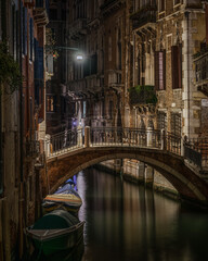 Obraz na płótnie Canvas Scenic night view of a typical Venetian canal, Venice, Italy