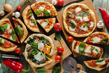 Homemade fresh pizza slices with vegetables, greens and mushrooms