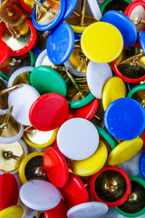 push pins background.Set of push pins in different colors.Top view.