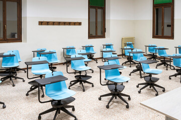 social distancing between school desks in an empty classroom