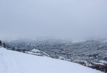 Beautiful view of Sarajevo in winter. Sarajevo under the snow. View of snowy Sarajevo from the mountain Trebevic.