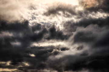 Beautiful View of dark cloudscape during dramatic sunset. Art Render. Taken in British Columbia, Canada.