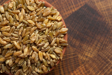 Freekeh Grain on a Dark Wooden Butcher Block