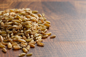 Freekeh Grain on a Dark Wooden Butcher Block