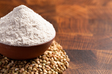 Buckwheat Flour on a Dark Wooden Butcher Block