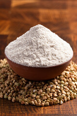 Buckwheat Flour on a Dark Wooden Butcher Block