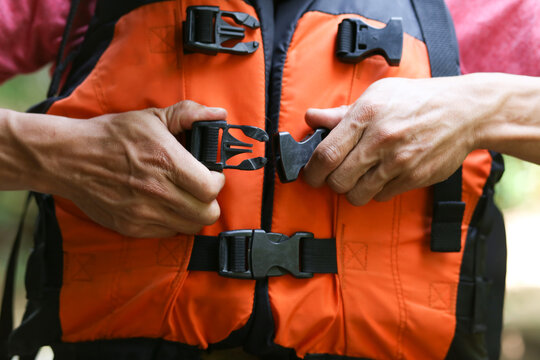 Midsection Of Man Wearing Life Jacket