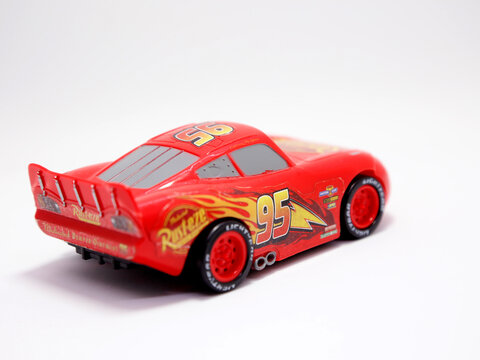 Cars. Lightning MCQUEEN. Toy car for Children. Pixar Cars movie. Red car. Number 95. Rust-eze. Isolated white. Back view.