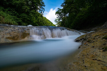 Obraz premium なめらかな滝の流れ