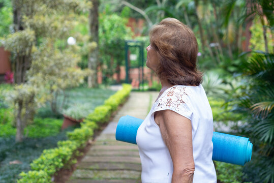 Senior Woman Going To Yoga Class