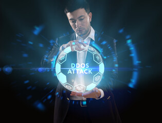 Business, Technology, Internet and network concept. Young businessman working on a virtual screen of the future and sees the inscription: Ddos attack