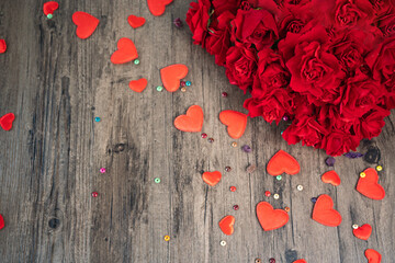 Selective focus roses and red hearts on wooden board, Valentines Day background, wedding day