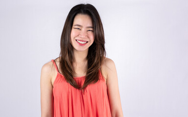 Fototapeta premium Asian woman smiling and wearing pink shirt for summer vacation