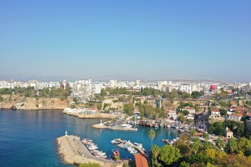 Fototapeta na wymiar Yacht marina. The beautiful View of the city, yachts and marina in Antalya. Antalya is popular tourist destination in Turkey is a district on the Mediterranean coast. 