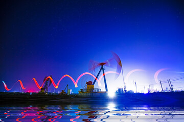 Oil pumping machinery in operation, crude oil extraction scene in the night, North China