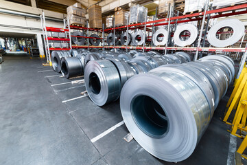 Tiered rack with sheet metal rolls. Internal warehouse of raw materials