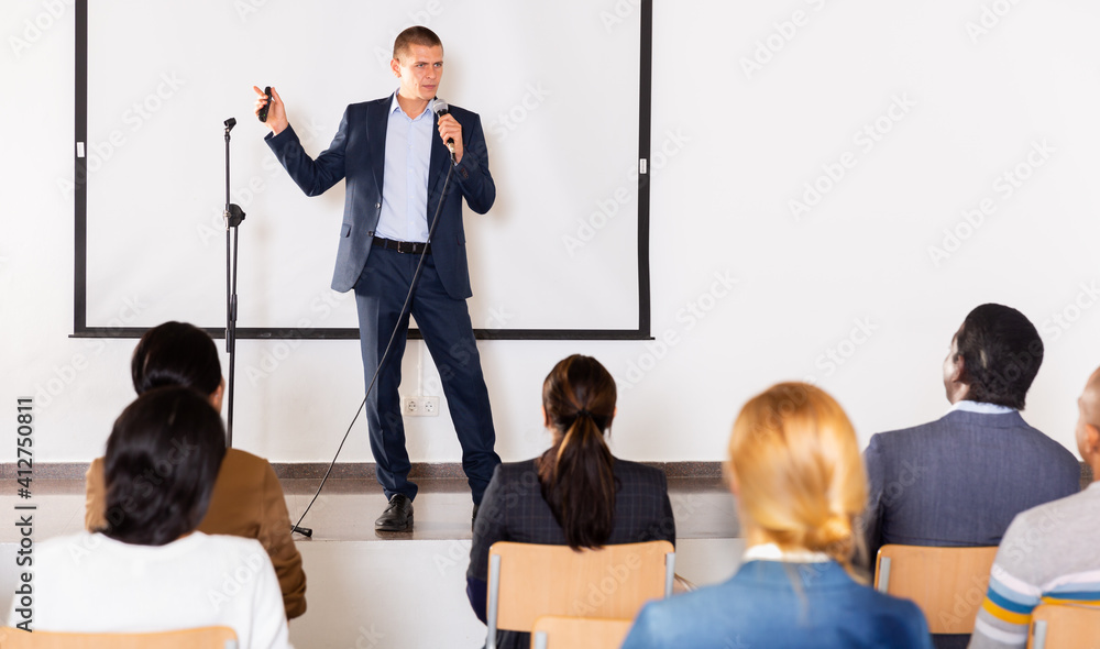 Sticker Portrait of confident successful man giving motivation training at conference hall