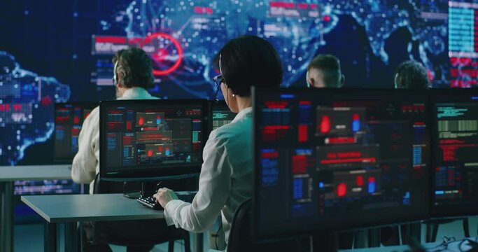 Team of programmers using computers