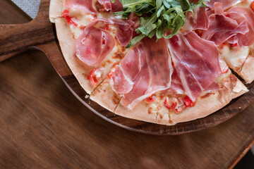 parma ham pizza on the table
