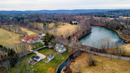 Naklejka premium landscape with a river and a bridge