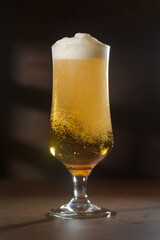 Beer.Pint of Beer close up isolated on abstract background. Cold Craft light Beer in a glass