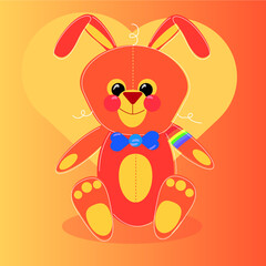 Toy orange rabbit on the background with a heart.