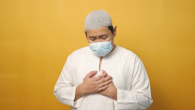 Asian Male Muslim Crying And Pray To God Against Coronavirus Covid 19 Pandemic Disease. Stress In Lockdown Quarantine