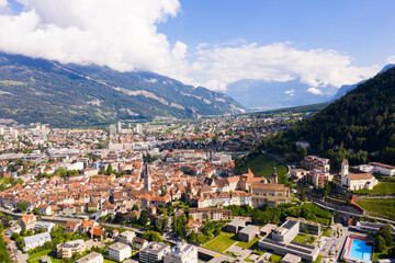 Fototapeta na wymiar Picturesque aerial view of Swiss town of Chur surrounded by mountains