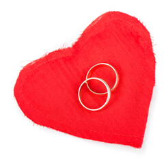 Big red heart from the fabric, two gold wedding rings