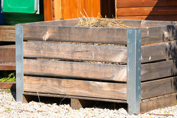 compost wooden crate or container outdoors filled with organic decaying matter concept...