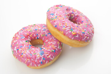 Two pink donuts on a white background