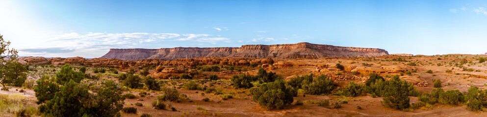 Panorama shot of orange massif of rock in american desert near canyonlands at sunny day in Utah