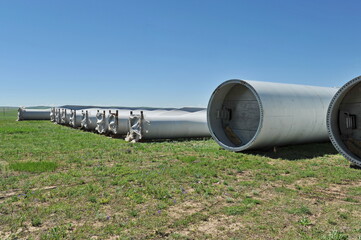 Zhambyl region, Kazakhstan - 05.15.2013 : New parts of wind turbines are laid out in an open field for subsequent assembly