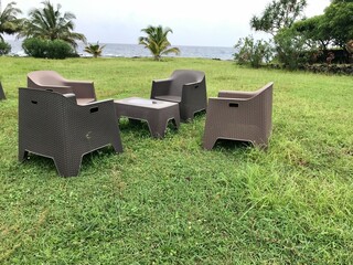 View of a beautiful lawn with chairs and table. This picture was taken from the seashore in Moroni...
