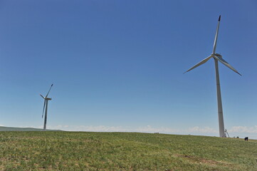 Zhambyl region, Kazakhstan - 05.15.2013 : Wind turbines located in an open hilly area to collect energy.