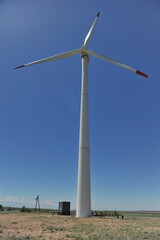 Zhambyl region, Kazakhstan - 05.15.2013 : Wind turbines located in an open hilly area to collect energy.