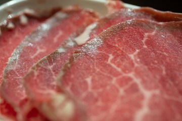 A close up detailed of raw freshly sliced beef