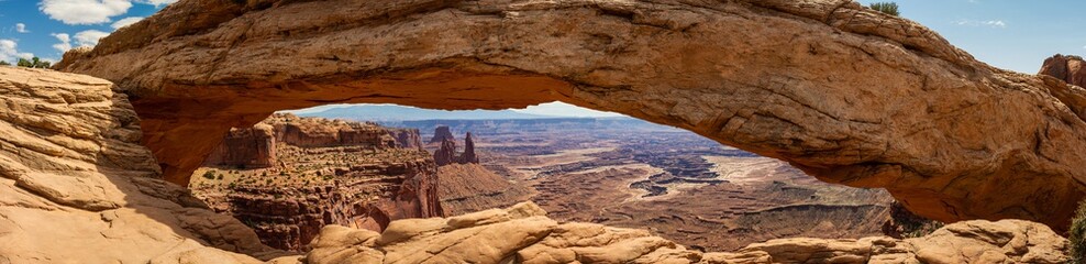 Close up of Mesa arch and look through to canyons at sunny day in canyonlands in utah, america