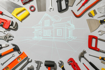 Set of different construction tools and building drawing on grey background