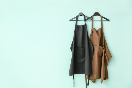 Clean aprons on color background