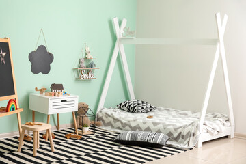 Stylish interior of modern children's room with baby bed