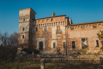 Fototapeta na wymiar Castello di Padernello. The Padernello Castle feels like castle out of fairy tale, with its working drawbridge and encircling moat. It was built at the end of the 14th century by the Martinengo family