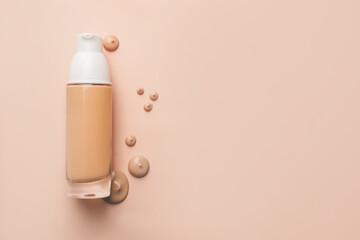 Bottle of makeup foundation and sample on color background