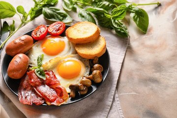 Traditional English breakfast with fried eggs in plate on grunge background