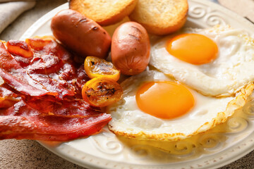 Traditional English breakfast with fried eggs in plate on light background