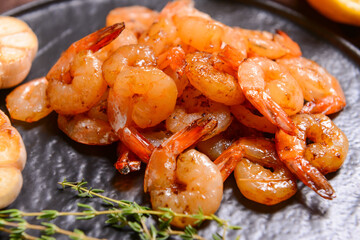 Plate of tasty shrimps and thyme, closeup