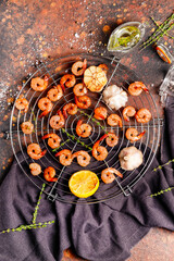 Grid with tasty shrimps on grunge background
