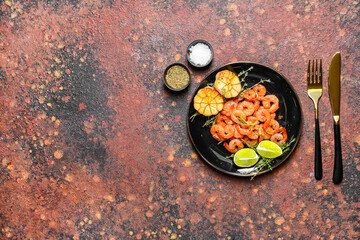 Plate with tasty shrimps on grunge background