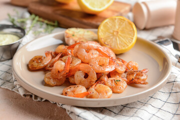 Plate with tasty shrimps on table, closeup