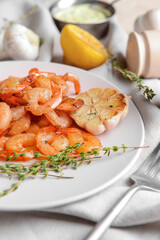 Plate with tasty shrimps on table, closeup